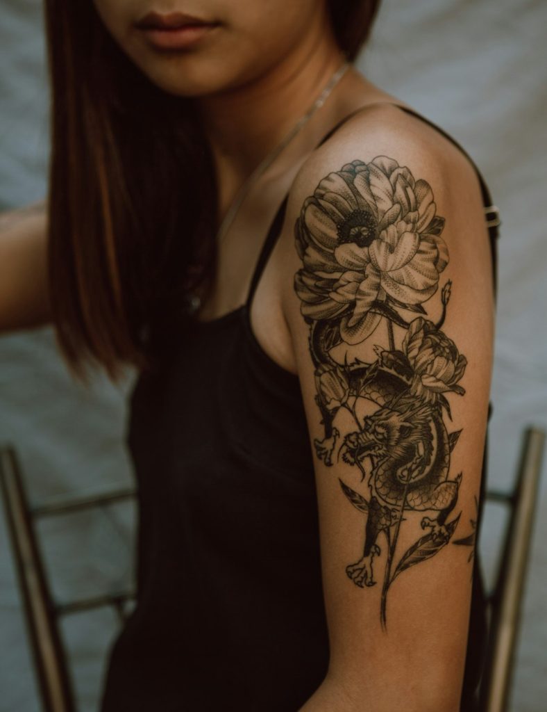 Delhi Ink Tattooz and Piercing Studio – Complete Price List 2025 woman-with-black-and-brown-floral-tattoo-on-her-back-wbwof8z-ngq